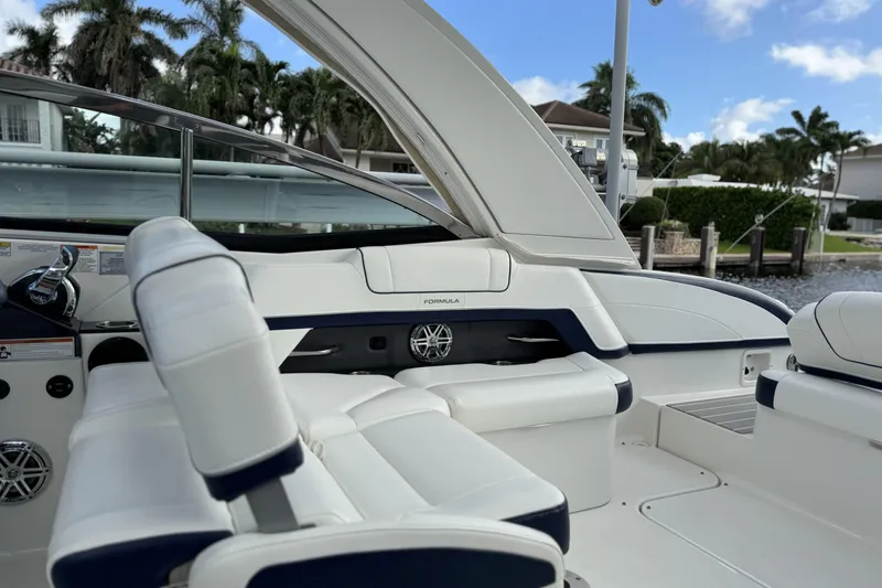Slide: The Image of 2021 Formula 330 Crossover Bowrider OB interior with white seating and sleek design. - 28