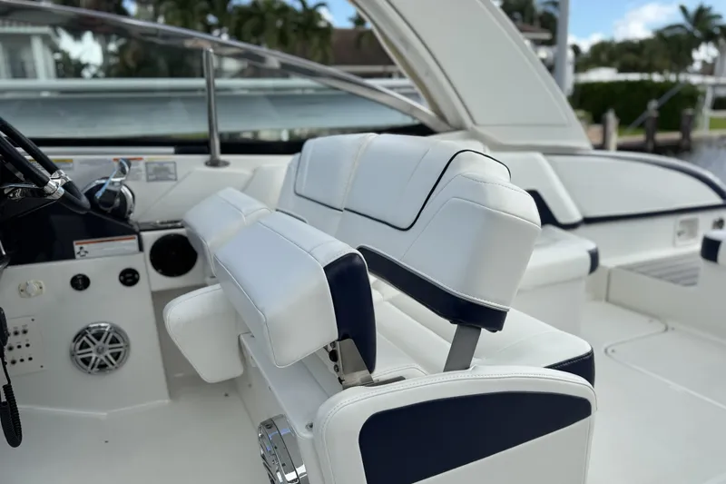 Slide: The Image of 2021 Formula 330 Crossover Bowrider OB interior with white and navy seating. - 29