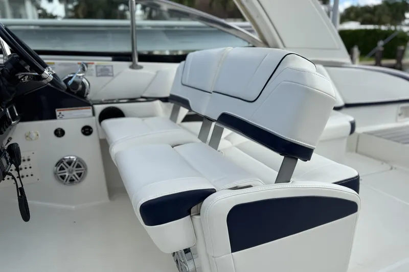 Slide: The Image of 2021 Formula 330 Crossover Bowrider OB interior with white and navy seating. - 30