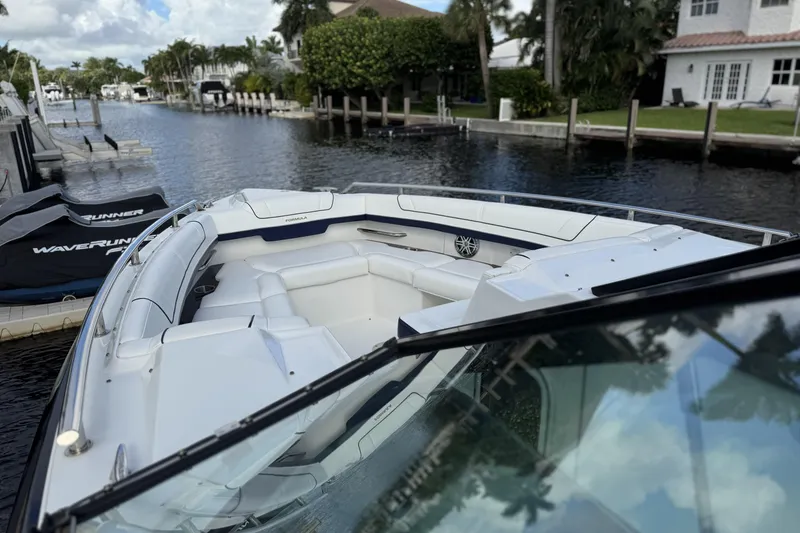 Slide: The Image of 2021 Formula 330 Crossover Bowrider OB docked in a scenic canal setting. - 41