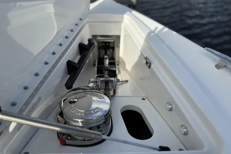 Slide: The Image of 2021 Formula 330 Crossover Bowrider OB anchor compartment detail with stainless steel fittings. - 45