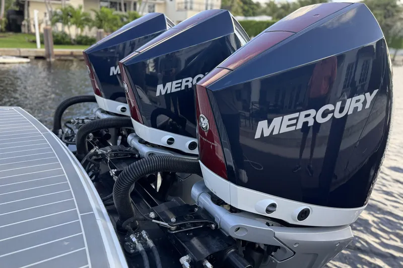 Slide: The Image of Triple Mercury outboard engines on a 2021 Formula 330 Crossover Bowrider OB boat. - 5