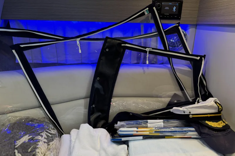 Slide: The Image of Interior of 2021 Formula 330 Crossover Bowrider OB with accessories and captain's hat. - 54