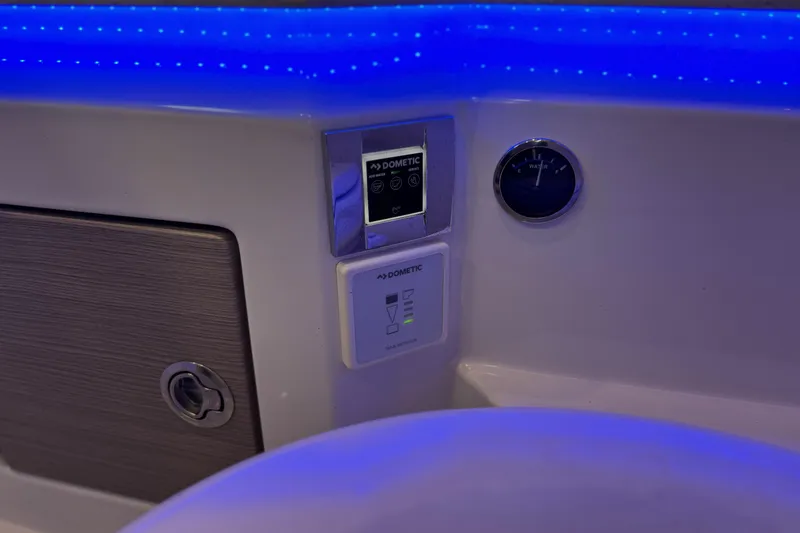 Slide: The Image of Control panel and gauge on 2021 Formula 330 Crossover Bowrider OB, illuminated by blue LED lights. - 59