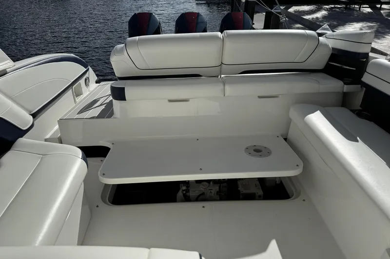 Slide: The Image of 2021 Formula 330 Crossover Bowrider OB interior with white seating and table. - 62
