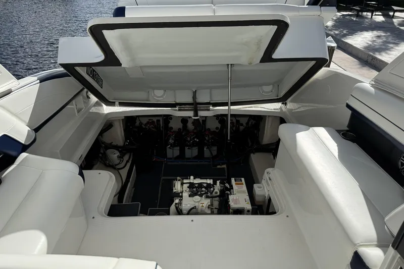 Slide: The Image of 2021 Formula 330 Crossover Bowrider OB engine compartment, open hatch, dockside view. - 63
