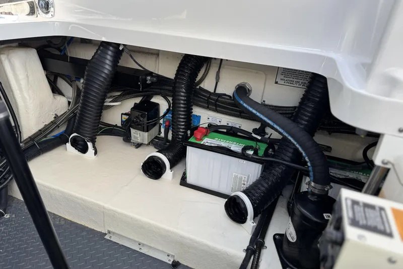 Slide: The Image of Engine compartment of 2021 Formula 330 Crossover Bowrider OB with visible battery and wiring. - 65