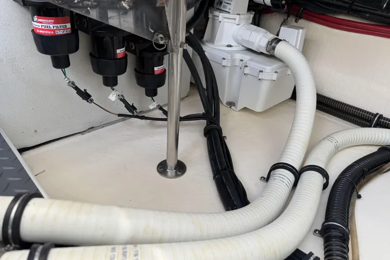 Slide: The Image of Engine compartment of 2021 Formula 330 Crossover Bowrider OB with fuel filters and hoses. - 69