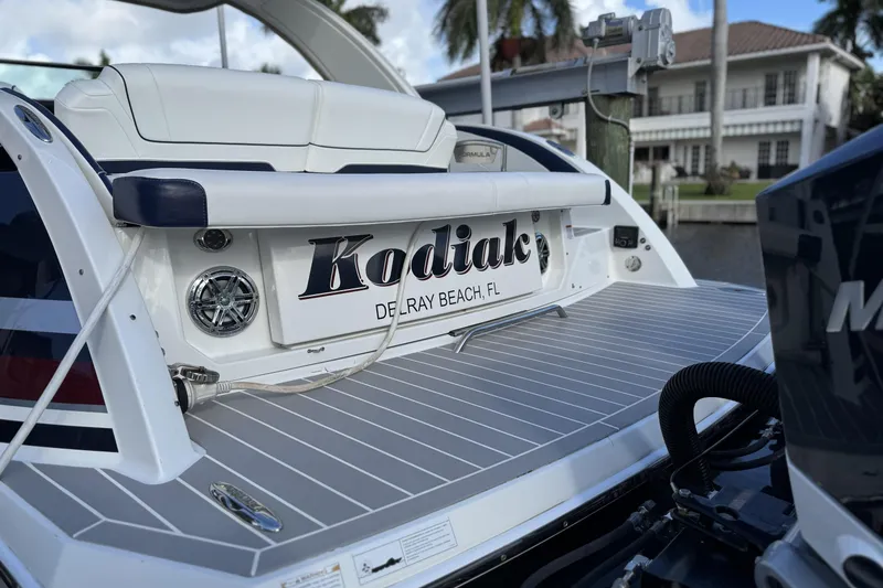 Slide: The Image of 2021 Formula 330 Crossover Bowrider OB boat docked, featuring "Kodiak" nameplate, Delray Beach, FL. - 9