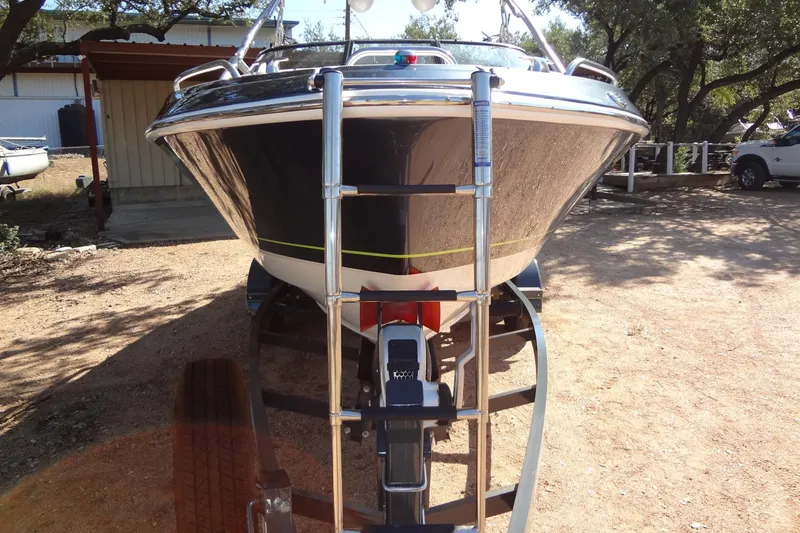 Slide: The Image of 2020 Formula 240 Bowrider boat on trailer, rear view, outdoors. - 12