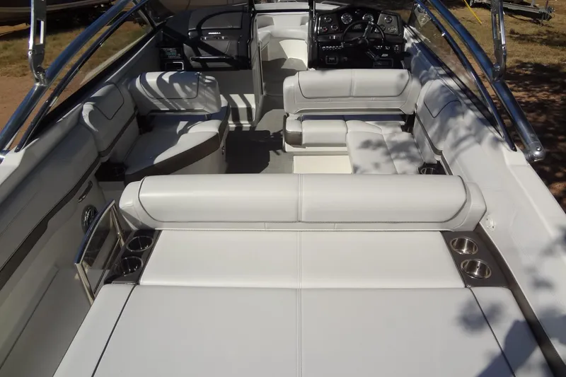 Slide: The Image of 2020 Formula 240 Bowrider boat on trailer, parked outdoors. - 13