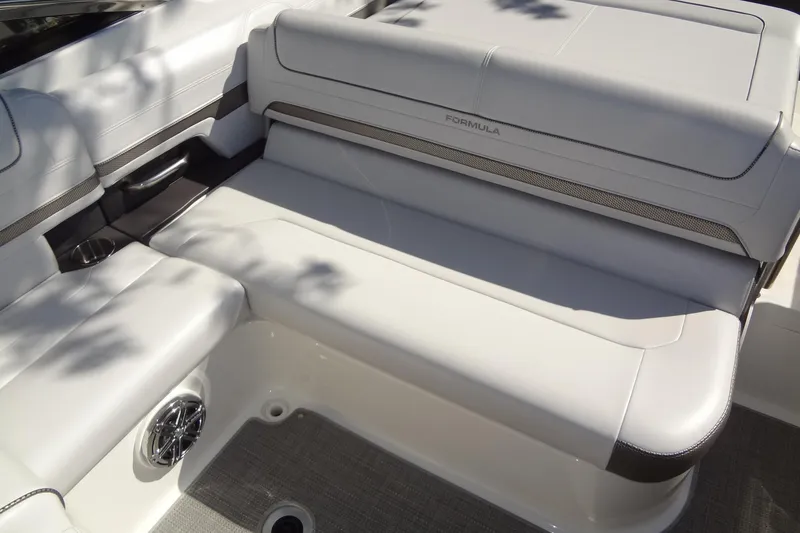 Slide: The Image of 2020 Formula 240 Bowrider boat deck with chrome details and seating area. - 18