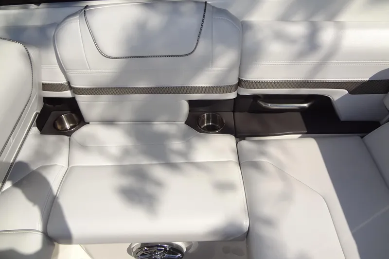 Slide: The Image of 2020 Formula 240 Bowrider boat on trailer, front view, parked outdoors. - 19