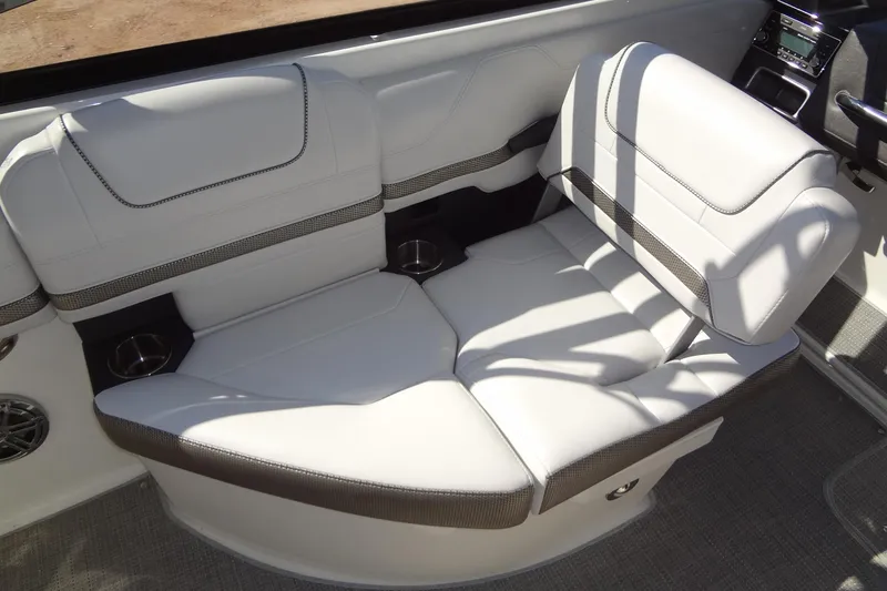 Slide: The Image of 2020 Formula 240 Bowrider boat interior with white leather seating and cup holders. - 21