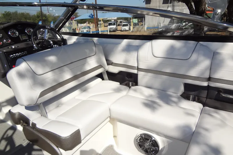 Slide: The Image of 2020 Formula 240 Bowrider boat with luxurious white seating and cup holders. - 22