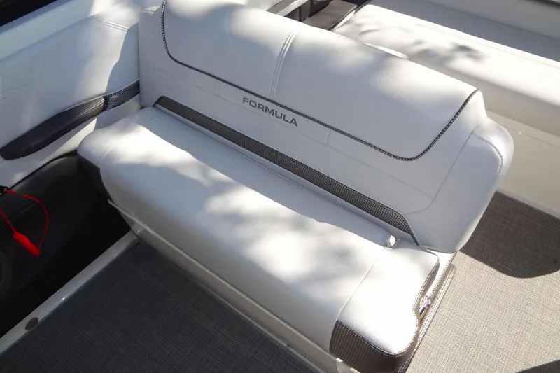 Slide: The Image of 2020 Formula 240 Bowrider interior with white leather seating and cup holders. - 24