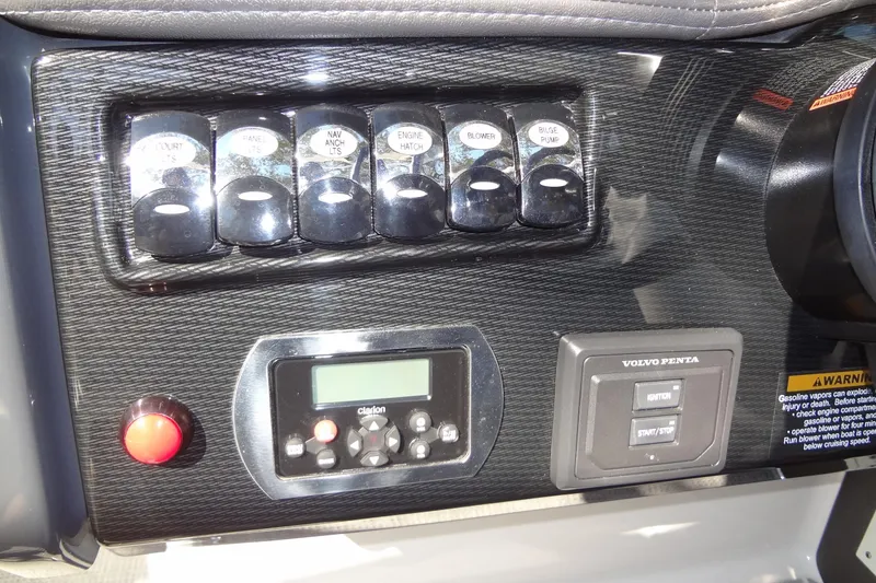 Slide: The Image of 2020 Formula 240 Bowrider interior seating with white upholstery and cup holders. - 28