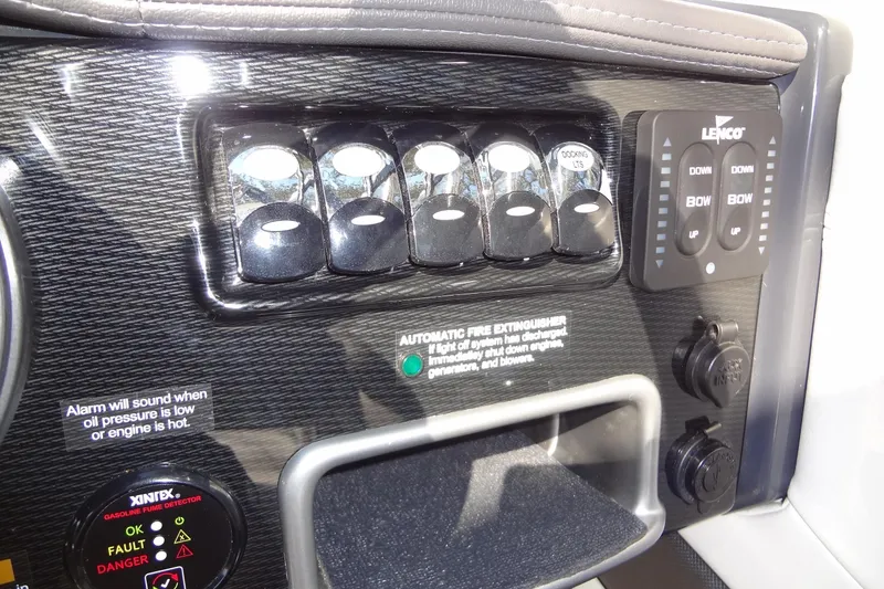 Slide: The Image of 2020 Formula 240 Bowrider interior with white leather seating and modern dashboard. - 29