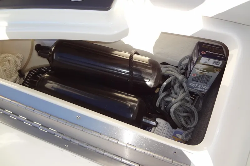 Slide: The Image of Compact bathroom in 2020 Formula 240 Bowrider boat with portable toilet and supplies. - 42