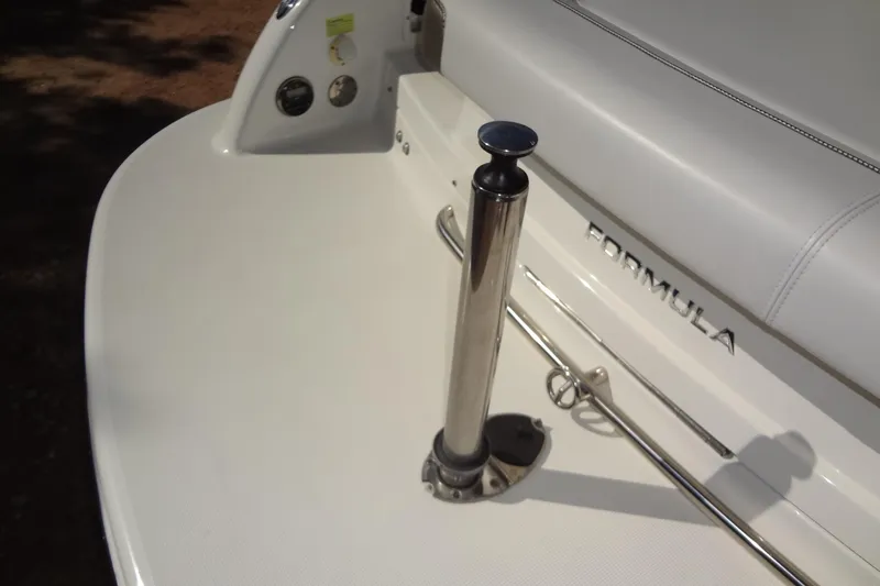 Slide: The Image of 2020 Formula 240 Bowrider interior with cushioned seating and cup holders. - 47