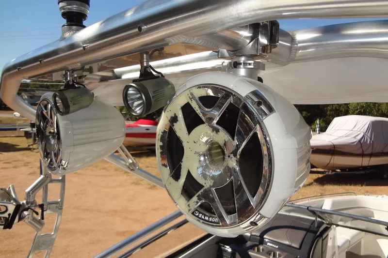 Slide: The Image of 2020 Formula 240 Bowrider boat interior with white cushioned seating and cup holders. - 50