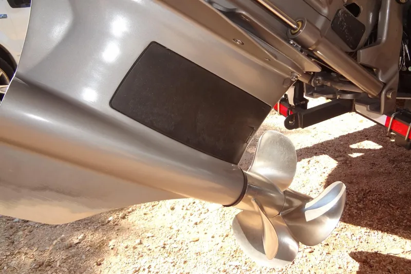 Slide: The Image of Wakeboard rack on a 2020 Formula 240 Bowrider boat, parked on sandy terrain. - 58