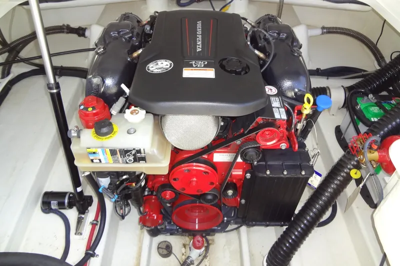 Slide: The Image of Engine compartment of a 2020 Formula 240 Bowrider boat, showcasing detailed components. - 62