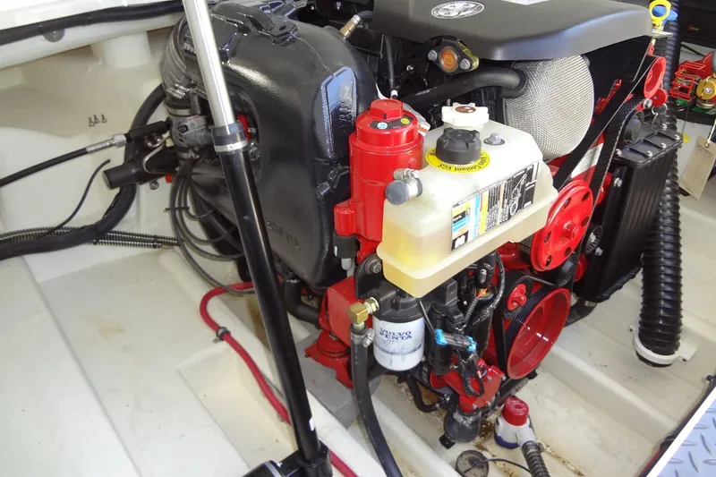 Slide: The Image of Engine compartment of a 2020 Formula 240 Bowrider boat, featuring Volvo Penta components. - 63