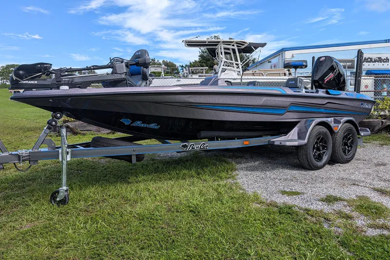 Slide: The Image of 2026 Bass Cat Eyra SP boat on trailer, featuring sleek design and modern equipment. - 3