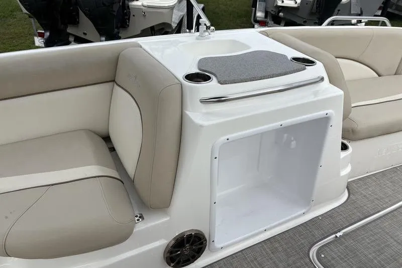 Slide: The Image of 2022 NauticStar 203 SC boat with 150 HP engine, viewed from the rear deck. - 12