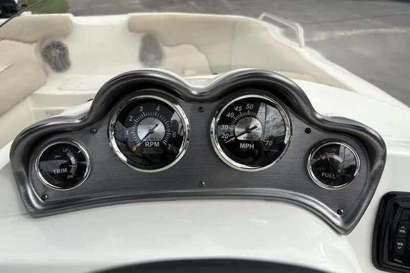 Slide: The Image of 2022 NauticStar 203 SC boat dashboard with steering wheel and control panel. - 17