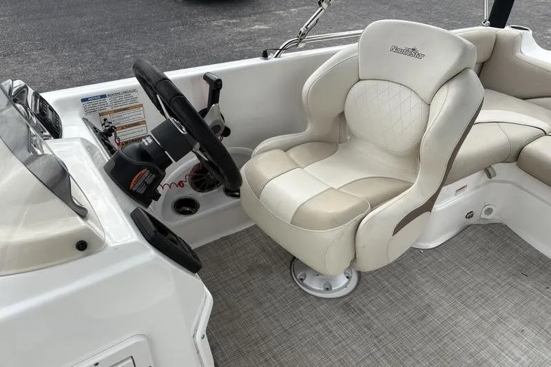 Slide: The Image of Dashboard of 2022 NauticStar 203 SC boat with RPM, MPH, and fuel gauges. - 18