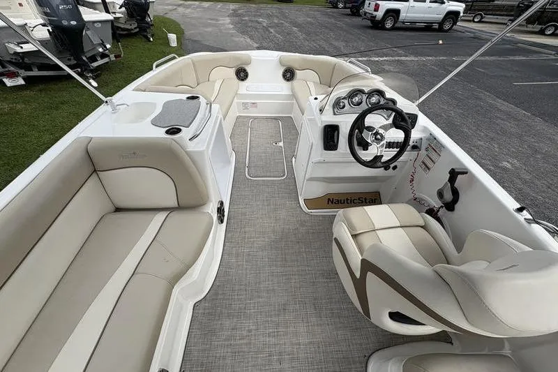 Slide: The Image of 2022 NauticStar 203 SC boat on trailer outside The Boat Shed dealership. - 4