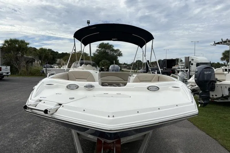 Slide: The Image of 2022 NauticStar 203 SC boat on trailer with Yamaha engine, parked outdoors. - 8