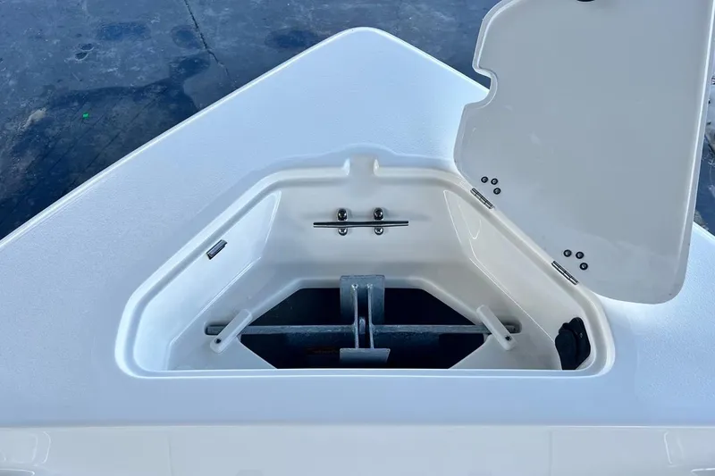 Slide: The Image of Open anchor compartment on 2026 Key West 189 FS boat, showcasing storage space. - 11