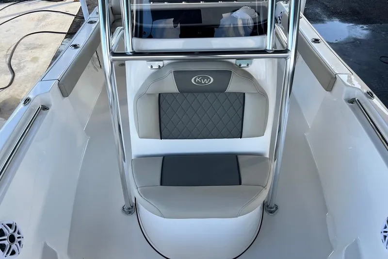 Slide: The Image of 2026 Key West 189 FS boat interior with cushioned seating and stainless steel railings. - 12