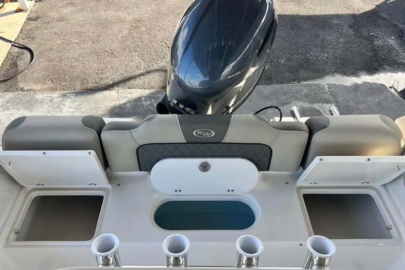 Slide: The Image of 2026 Key West 189 FS boat interior with motor and storage compartments. - 16