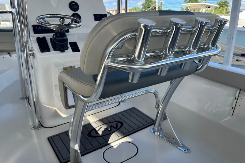 Slide: The Image of 2026 Key West 189 FS boat interior with steering console and rod holders. - 17
