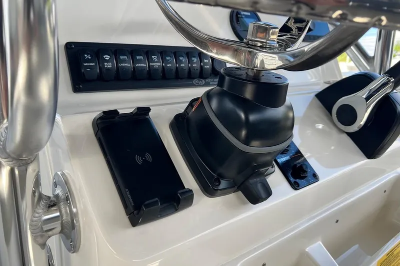 Slide: The Image of 2026 Key West 189 FS boat dashboard with steering wheel and control panel. - 19