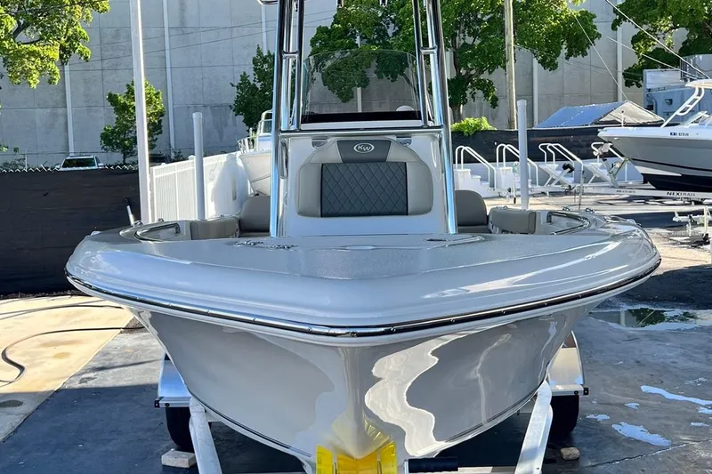 Slide: The Image of 2026 Key West 189 FS boat displayed outdoors, showcasing sleek design and modern features. - 2