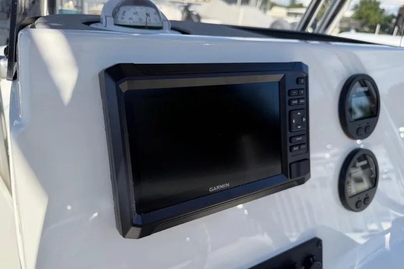 Slide: The Image of Dashboard of 2026 Key West 189 FS boat with Garmin display and gauges. - 20