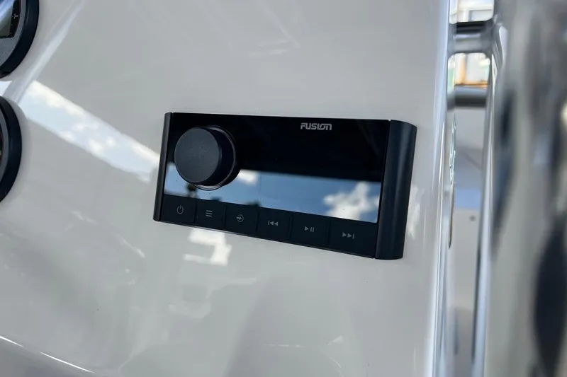 Slide: The Image of Fusion audio control panel on 2026 Key West 189 FS boat dashboard. - 21