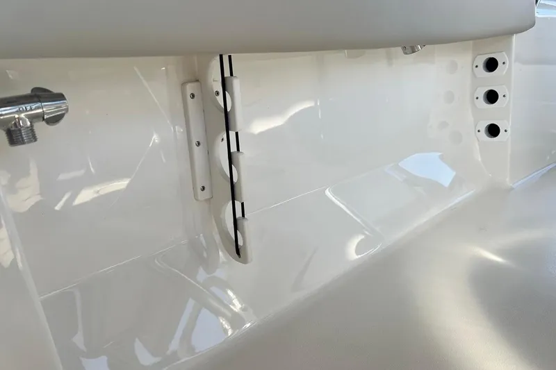 Slide: The Image of 2026 Key West 189 FS boat interior detail with sleek white finish and fittings. - 25