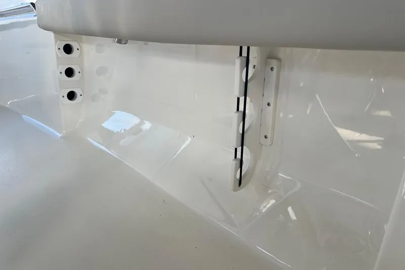 Slide: The Image of Interior view of 2026 Key West 189 FS boat, featuring rod holders and sleek design. - 26