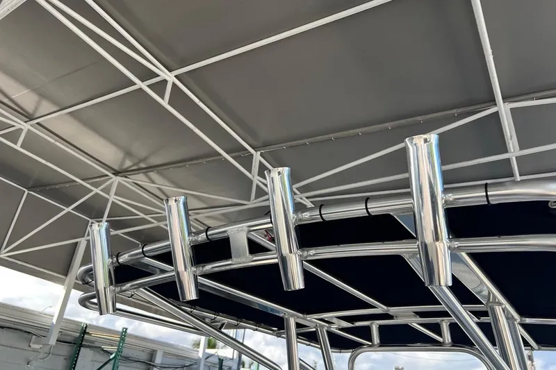 Slide: The Image of T-top frame of 2026 Key West 189 FS boat with rod holders. - 27