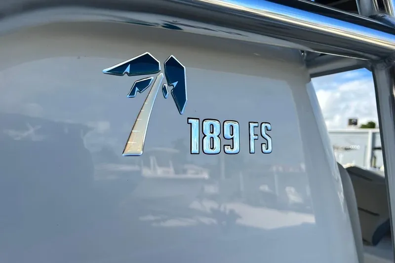 Slide: The Image of 2026 Key West 189 FS boat logo with palm tree design. - 31