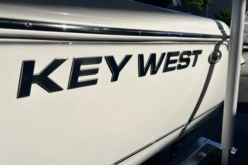Slide: The Image of 2026 Key West 189 FS boat side view with logo in sunlight. - 32