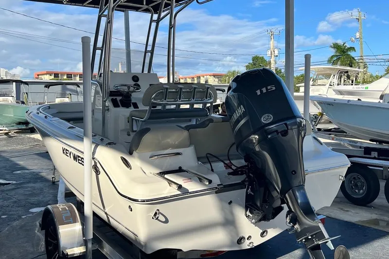 Slide: The Image of 2026 Key West 189 FS boat with Yamaha 115 engine, parked on a trailer. - 5