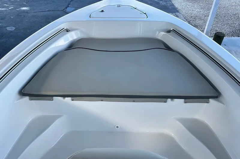 Slide: The Image of 2026 Key West 189 FS boat interior with cushioned seating area. - 8