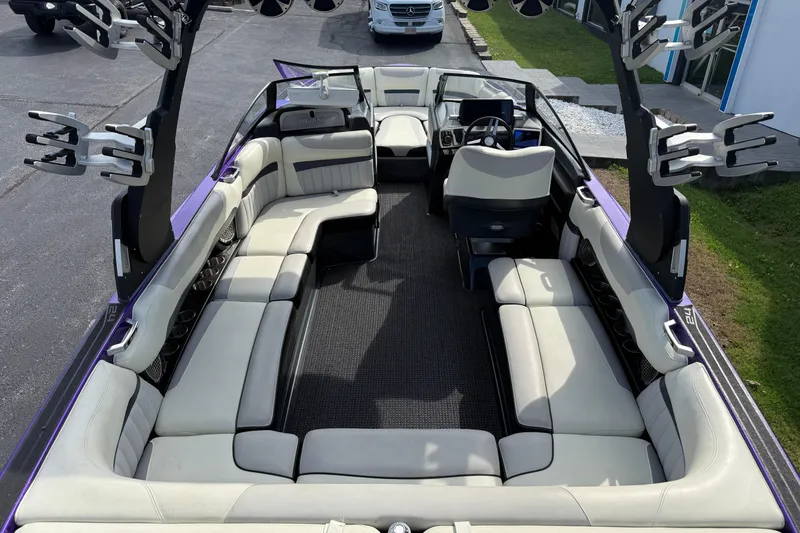Slide: The Image of 2015 Malibu Wakesetter 24 MXZ boat interior with spacious seating and sleek design. - 12